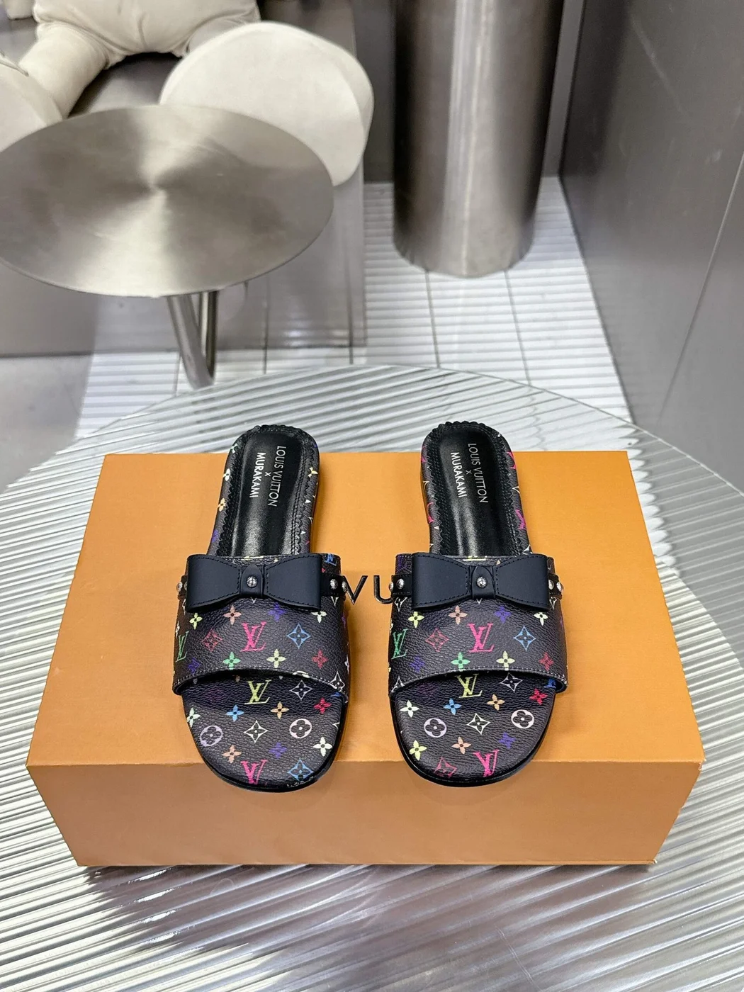Louis Vuitton Women Black Patterned Leather Bow Slide Sandals product view 1