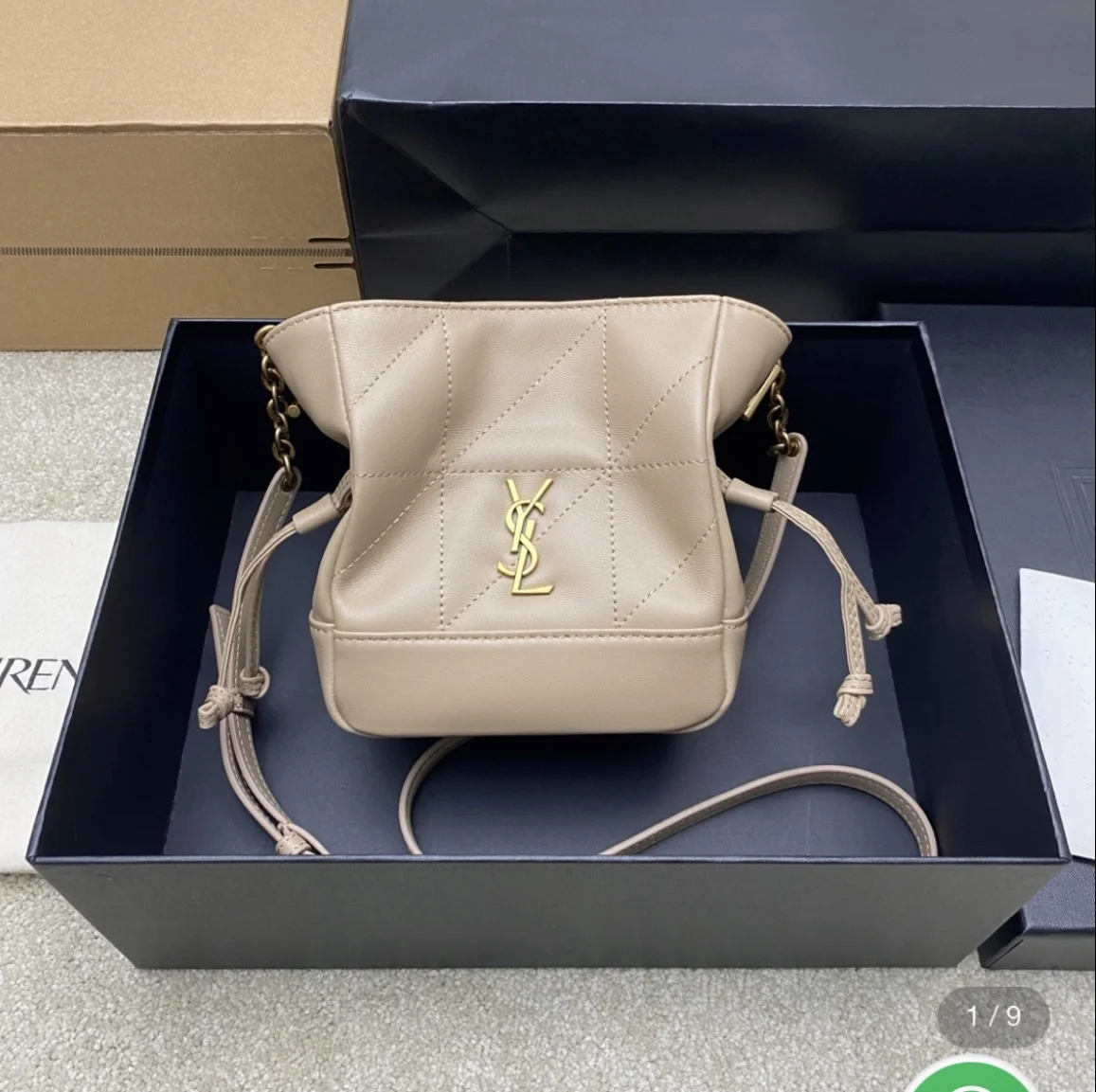 Saint Laurent Jamie mini shoulder pouch in beige lambskin leather. product view 1