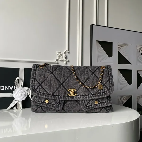 Chanel Maxi Flapbag in washed denim with gold-tone metal hardware Bag product view 1