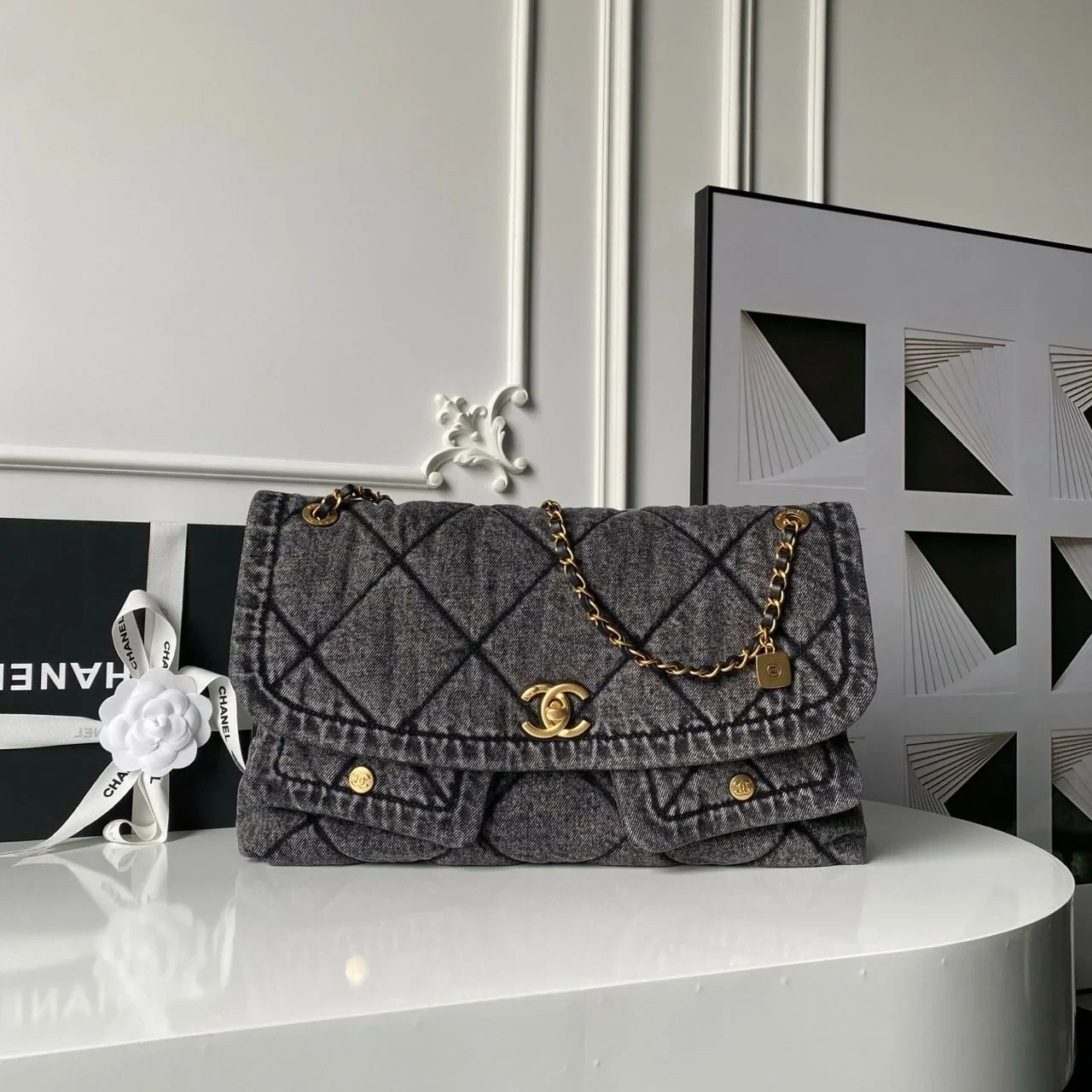 Chanel Maxi Flapbag in washed denim with gold-tone metal hardware Bag product view 1