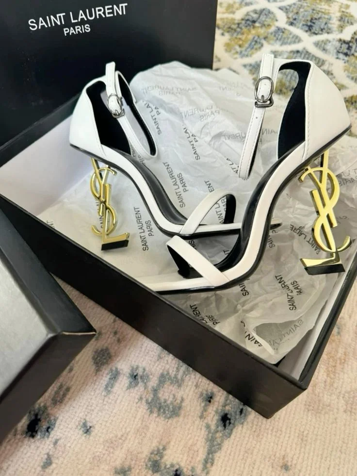 Saint Laurent white and black heels are the  Opyum model product view 1