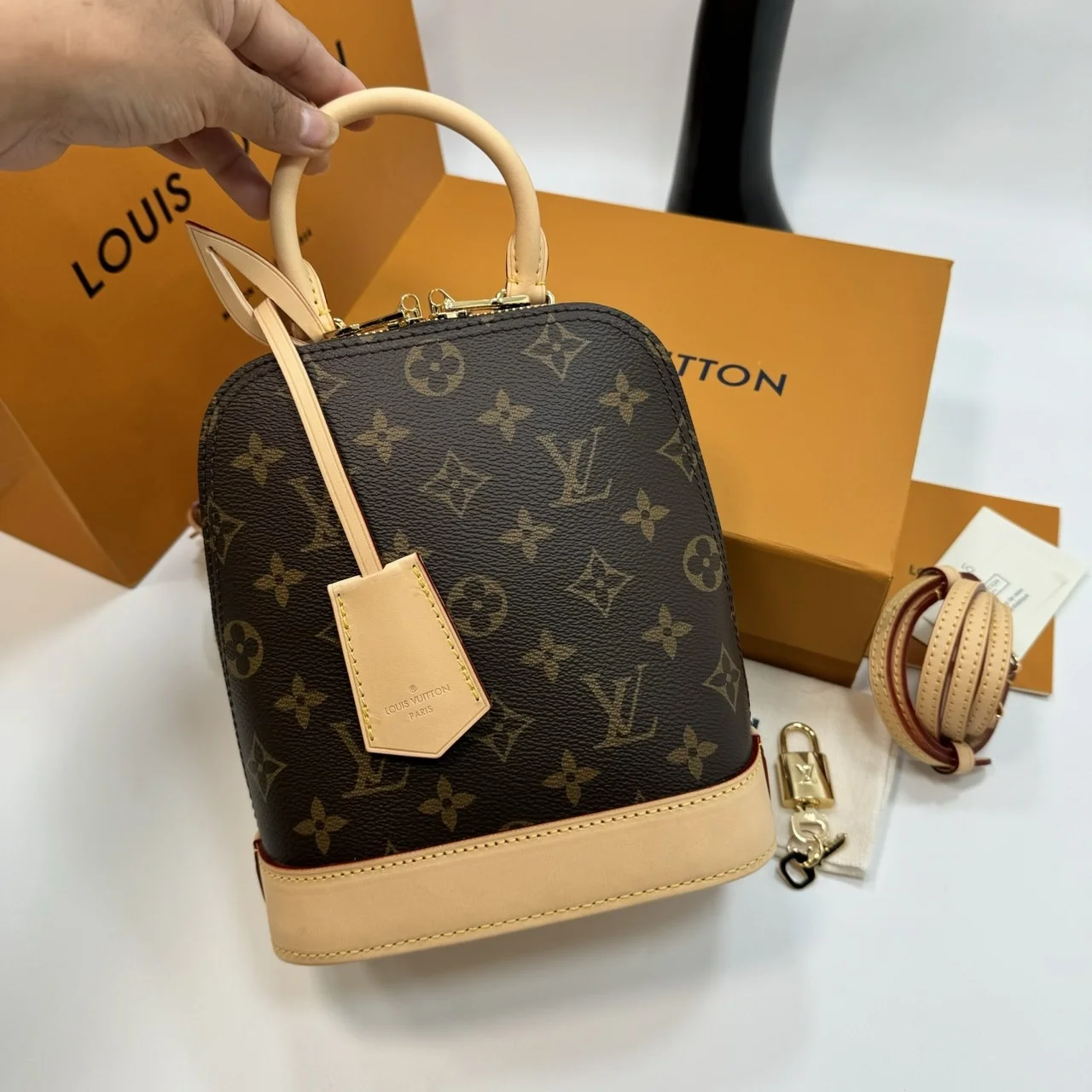 Louis Vuitton Alma backpack in the signature brown monogram canvas product view 1