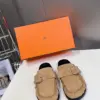 Hermès Women Beige Suede Buckle Mules product view 1