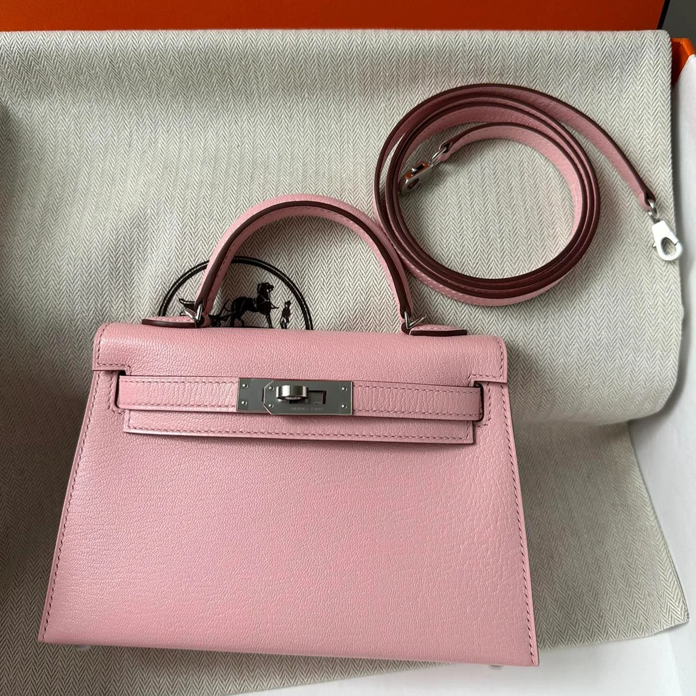Hermès Mini Kelly 20 bag in Rose Sakura leather with silver hardware