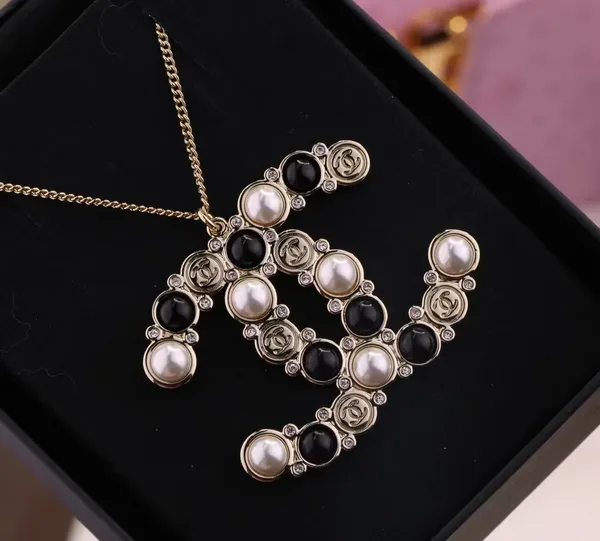 Chanel Oversized Pearl-Effect CC Pendant Necklace Black and Gold-Tone product view 2