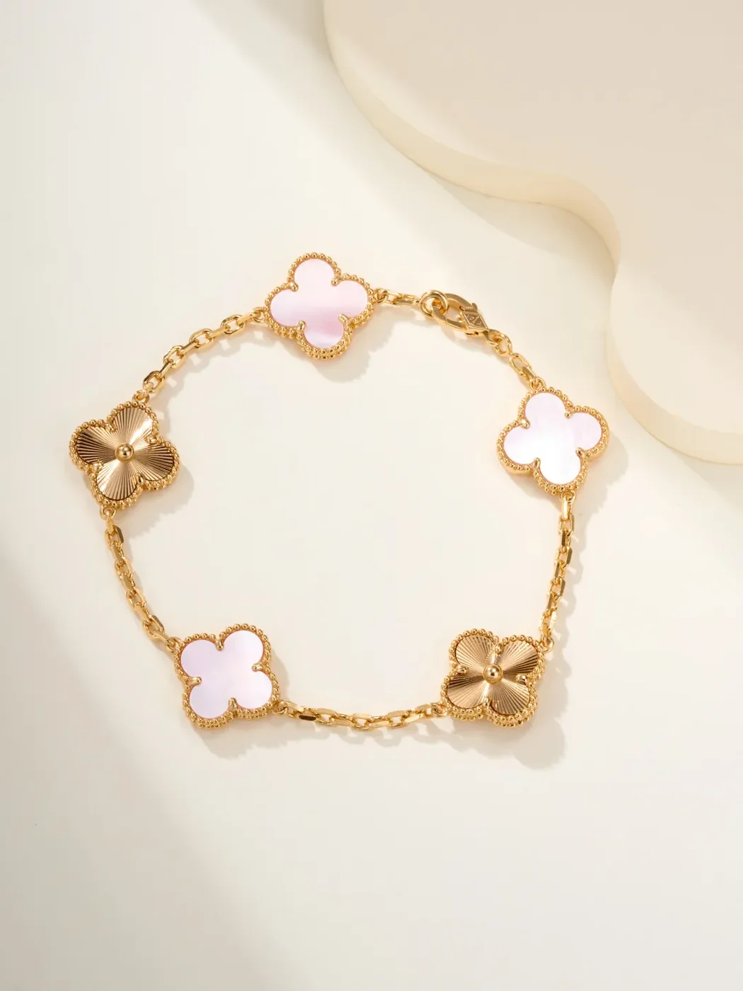 Van Cleef  Arpels Alhambra Pale Pink Clover and Gold-Tone Knot Bracelet product view 1