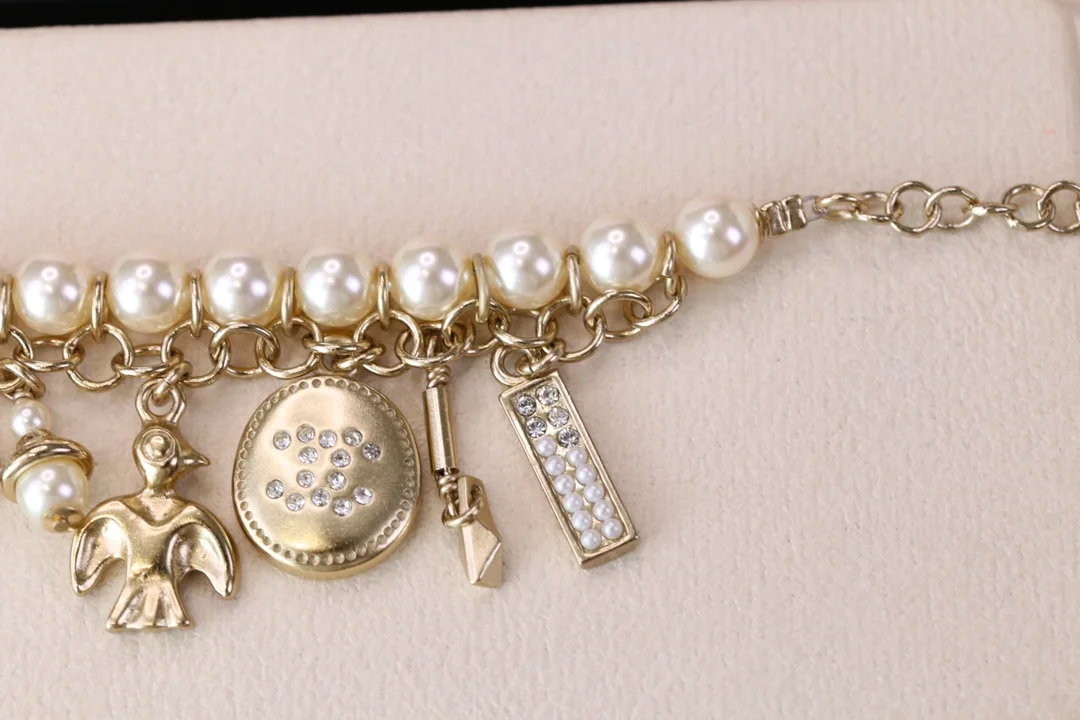 Chanel Bird CC Pearl-Effect Tassel Charm Bracelet Gold-Tone product view 7