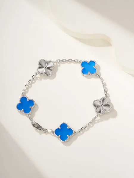 Van Cleef  Arpels Alhambra Blue Clover and Silver-Tone Knot Bracelet product photo