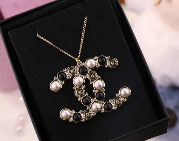 Chanel Oversized Pearl-Effect CC Pendant Necklace Black and Gold-Tone product photo