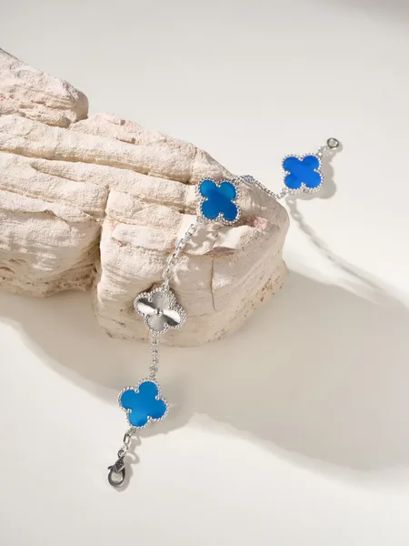 Van Cleef  Arpels Alhambra Blue Clover and Silver-Tone Knot Bracelet product view 2
