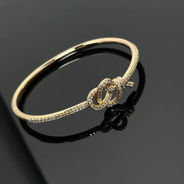 Tiffany  Co. Woven Knot Round Pavé-Effect Bangle Gold-Tone product photo