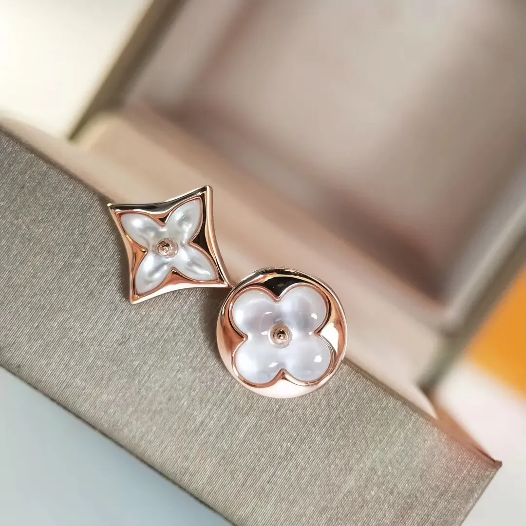 Louis Vuitton Asymmetric Star and Sun Pearlescent Stud Earrings Rose-Tone product view 1